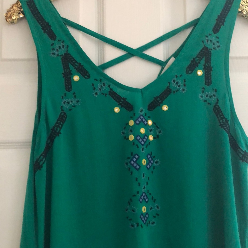 Green top with tassels